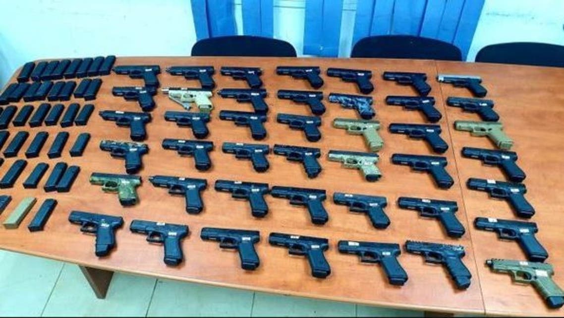 Dozens of guns seized by Israel Defense Forces during a smuggling operation from Lebanon, on July 10, 2021. (Twitter/IDF)