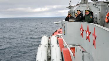 Russian President Putin (L) watches the joint drills by the Northern and Black Sea Fleets from onboard the cruiser Marshal Ustinov in the Black Sea off the coast of Crimea on January 9, 2020. (AFP)