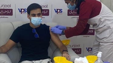 Patient Saeed al-Khoor receives his second shot of the Pfizer vaccine at the vaccination clinic at Burjeel Hospital for Advanced Surgery. (Photo: Al Arabiya English)