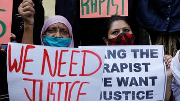 Demonstrators hold placards during a protest after the death of a rape victim, in New Delhi, India, October 4, 2020. (Reuters)