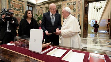 This handout photo taken and released on November 25, 2021 by the Vatican press office shows Pope Francis during a private audience with Lebanon's PM Najib Mikati at the Vatican. (Handout/Vatican Media/AFP)