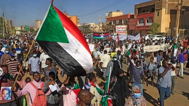 Sudanese protesters gather in the busy Jabra district of southern Khartoum on November 25, 2021. (Ashraf Shazly/AFP)