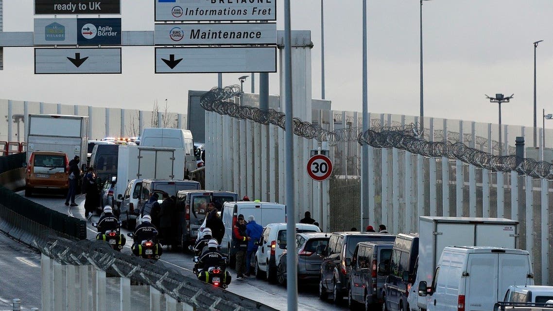 Cars and truck are stopped as French fishermen block the entrance of the Euro Tunnel, in Coquelles, northern France, Nov. 26, 2021. (AP/Michel Spingler)