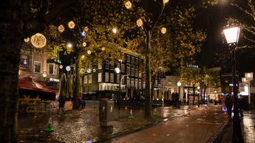 Closed bars and restaurants under a partial lockdown are seen on a near-deserted Rembrandt plein, or Rembrandt Square, in Amsterdam, Netherlands, on Nov. 26, 2021. (AP)