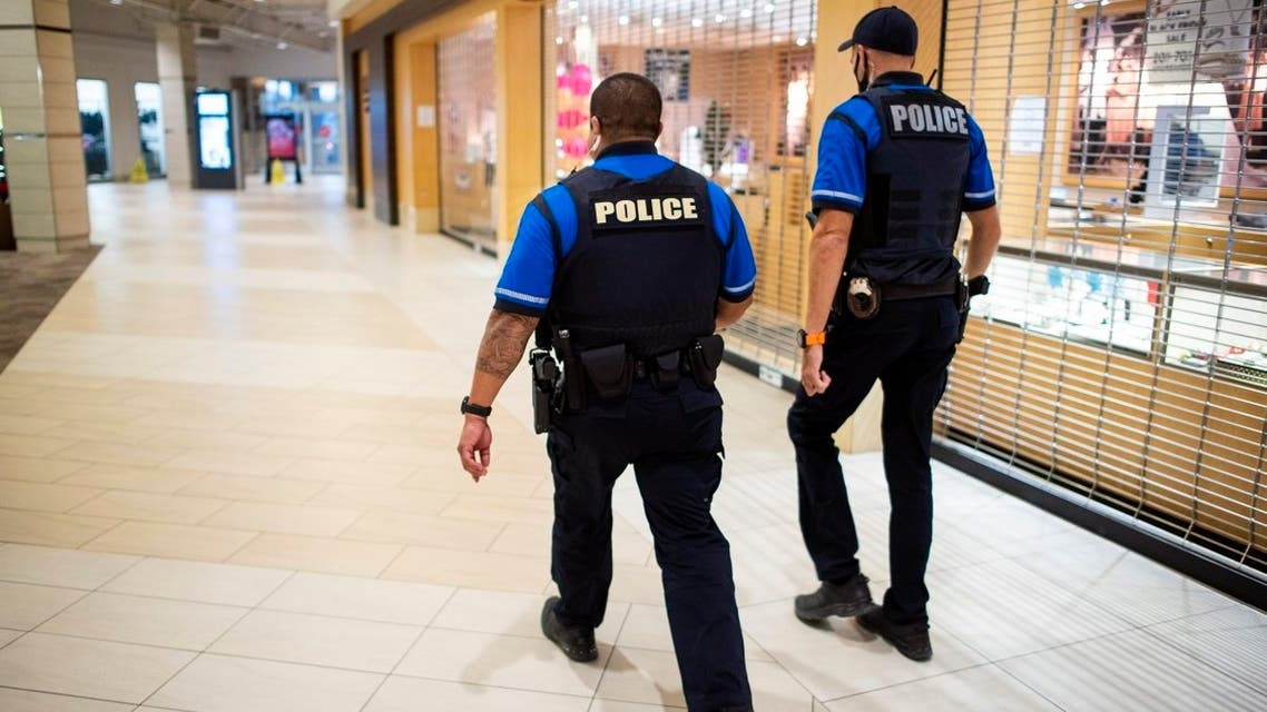 File photo of police patrolling near a store after a shooting ata Mall in Woodbridge, Vrginia, on Nov. 18, 2021.  (AP)
