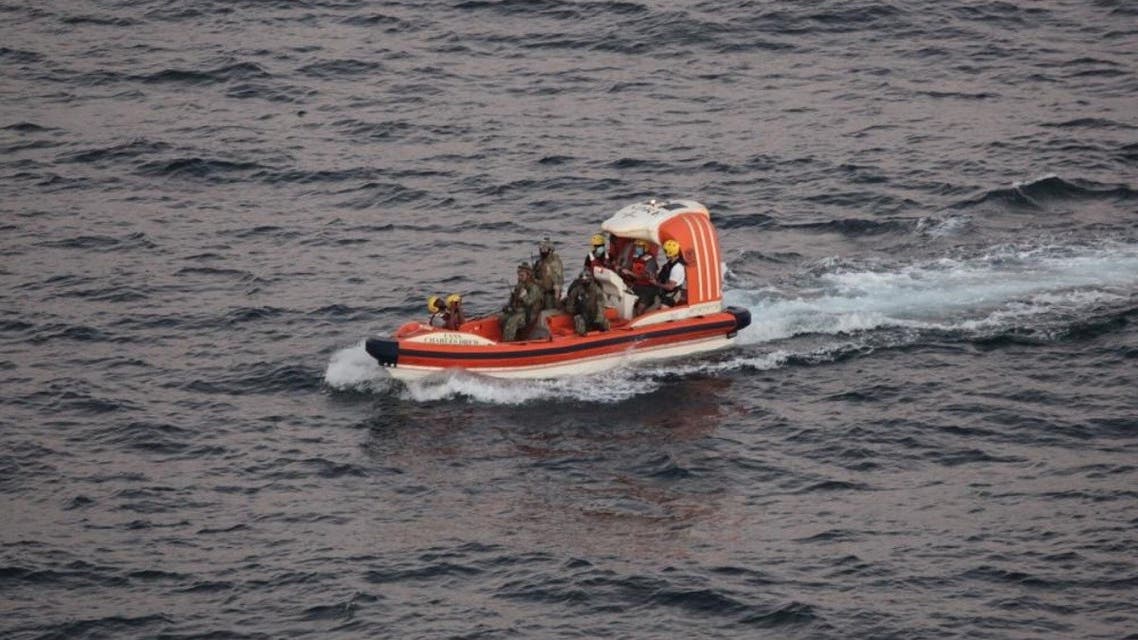 A handout picture provided by the US Navy on November 28, 2021, shows personnel from dry cargo ship USNS Charles Drew (T-AKE 10) transporting an Iranian mariner a day earlier after receiving a request for assistance from two mariners in the Gulf of Oman whose fishing vessel had been adrift at sea for eight days. (AFP)