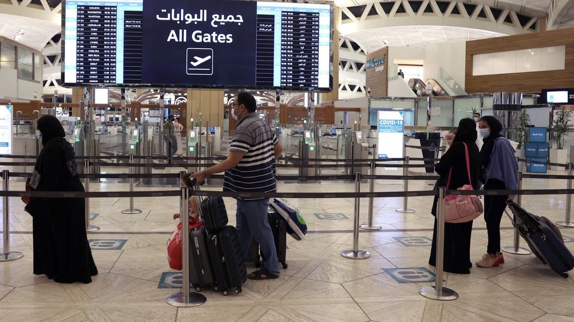 Saudi passengers arrive to King Khaled International airport in the capital Riyadh on May 17, 2021. (AFP)