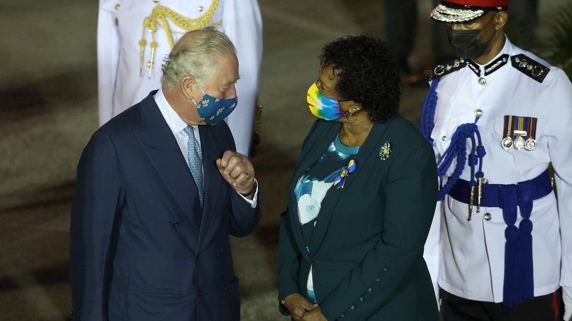 Britain's Prince Charles speaks with Barbadian President-elect Sandra Mason as he arrives in Barbados to attend a ceremony as the country declares itself a republic, in Barbados Airport, Barbados, on November 28, 2021. (Reuters)