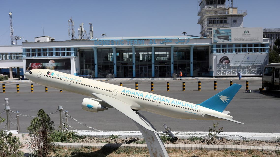 FILE PHOTO: A model of an Ariana Afghan Airlines jet is seen in front of the international airport in Kabul, Afghanistan, September 5, 2021. WANA (West Asia News Agency) via REUTERS ATTENTION EDITORS - THIS IMAGE HAS BEEN SUPPLIED BY A THIRD PARTY/File Photo