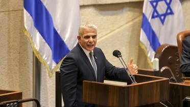 Israeli Foreign Minister Yair Lapid speaks during a plenum session and vote on the state budget at the assembly hall in the Knesset (Israeli parliament), in Jerusalem on November 3, 2021. (AFP)