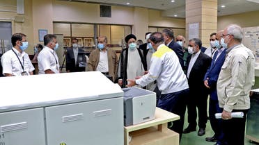 A handout picture provided by the Iranian presidency on October 8, 2021 shows Iran's president Ebrahim Raisi (4-L) visiting the Bushehr Nuclear Power Plant, southeast of the city of the same name. (Photo by Iranian Presidency / AFP) / === RESTRICTED TO EDITORIAL USE - MANDATORY CREDIT AFP PHOTO / HO / IRANIAN PRESIDENCY - NO MARKETING NO ADVERTISING CAMPAIGNS - DISTRIBUTED AS A SERVICE TO CLIENTS === - === RESTRICTED TO EDITORIAL USE - MANDATORY CREDIT AFP PHOTO / HO / IRANIAN PRESIDENCY - NO MARKETING NO ADVERTISING CAMPAIGNS - DISTRIBUTED AS A SERVICE TO CLIENTS ===