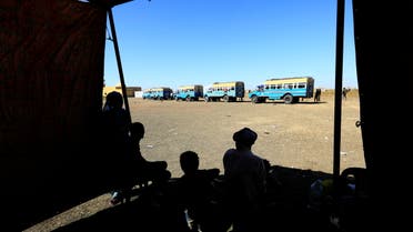 Ethiopian refugees who fled Tigray region, wait to board courtesy buses at the Fashaga camp as they are transferred to Um-Rakoba camp on the Sudan-Ethiopia border, in Kassala state, Sudan December 13, 2020. REUTERS/Mohamed Nureldin Abdallah