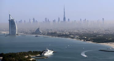 Burj Khalifa, the world's tallest tower, and luxury Burj al-Arab Hotel (L) are seen in a general view of Dubai, UAE December 9, 2015. (Reuters)