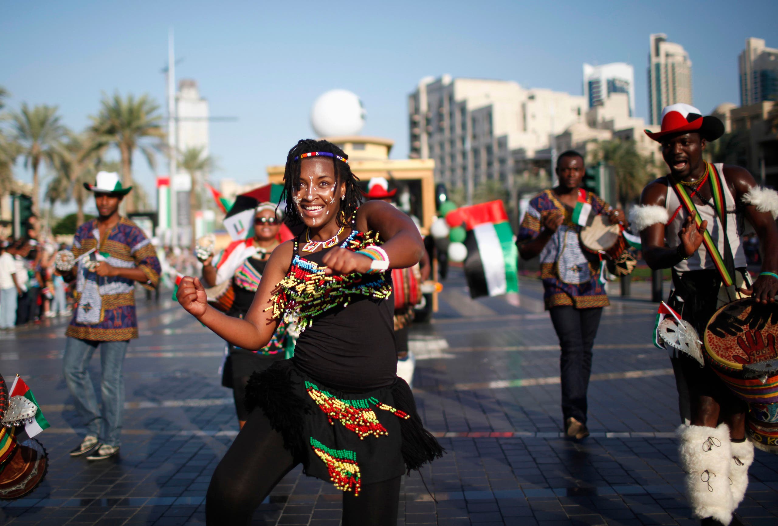 A woman dances during a parade celebrating the 41st National Day of the United Arab Emirates, in downtown Dubai December 2, 2012. (Reuters)