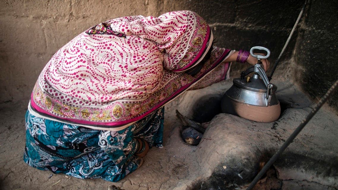 File photo of a woman checking her pressure cooker in her house. (Reuters)