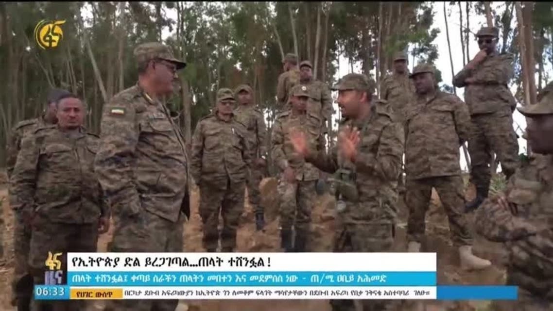 A screen grab from a video shows Ethiopian Prime Minister Abiy Ahmed talking to soldiers on a hillside in an unknown location in Ethiopia as continue their push against the rebellious Tigrayan fighters . (Reuters)
