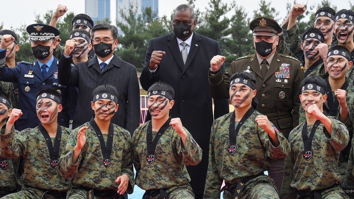 US Secretary of Defense Lloyd Austin (C) and South Korea’s Defense Minister Suh Wook (center L) pose with members of South Korea’s 2nd Army command during a taekwondo display in Seoul, December 2, 2021. (Song Kyung-Seok/Pool/AFP)