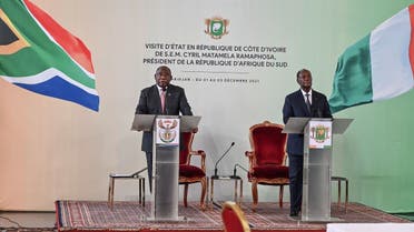South African President Cyril Ramaphosa (L) and Ivorian President Alassane Ouattara (R) address a press conference at the Presidential Palace in Abidjan on December 2, 2021. (Sia Kambou/AFP)