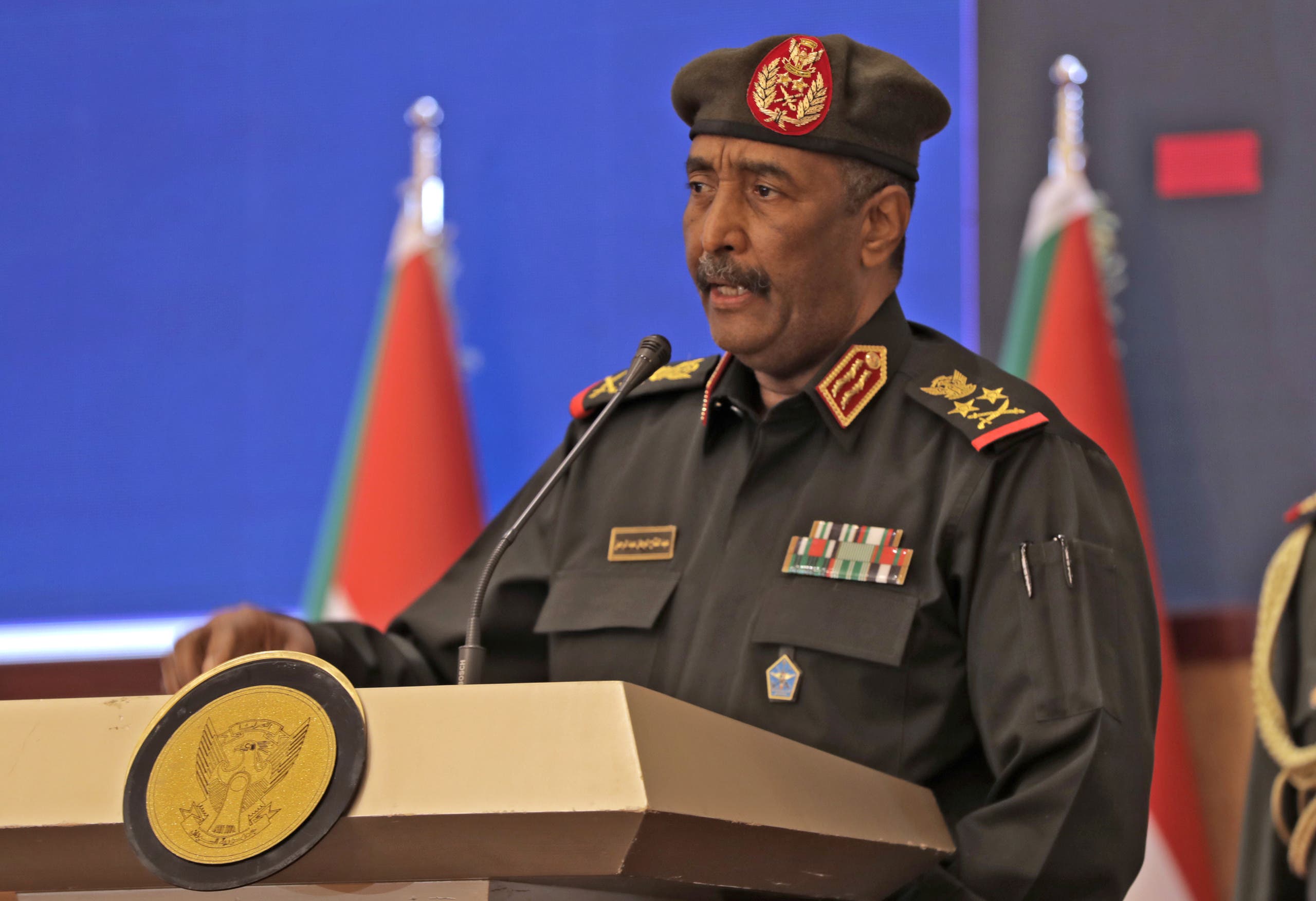 Sudan's top general Abdel Fattah al-Burhan speaks following a deal-signing ceremony with Prime Minister Abdalla Hamdok (unseen) to restore the transition to civilian rule in the country in the capital Khartoum, on November 21, 2021. Nearly a month after Sudan's top general ousted the prime minister, they signed a breakthrough deal to reverse the military takeover that had sparked international condemnation and mass protests. (Photo by AFP)