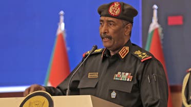 Sudan's top general Abdel Fattah al-Burhan speaks following a deal-signing ceremony with Prime Minister Abdalla Hamdok (unseen) to restore the transition to civilian rule in the country in the capital Khartoum, on November 21, 2021. (AFP)