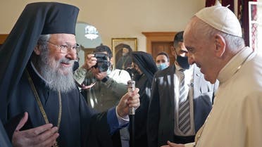In this handout picture released by the Cypriot government’s press office (PIO), Archbishop Chrysostomos II (L) of Cyprus welcomes Pope Francis (R) at the Archbishopric of the Greek Orthodox Church in Nicosia, Europe’s last divided capital, on December 3, 2021. (Andreas Loucaides/PIO/AFP)
