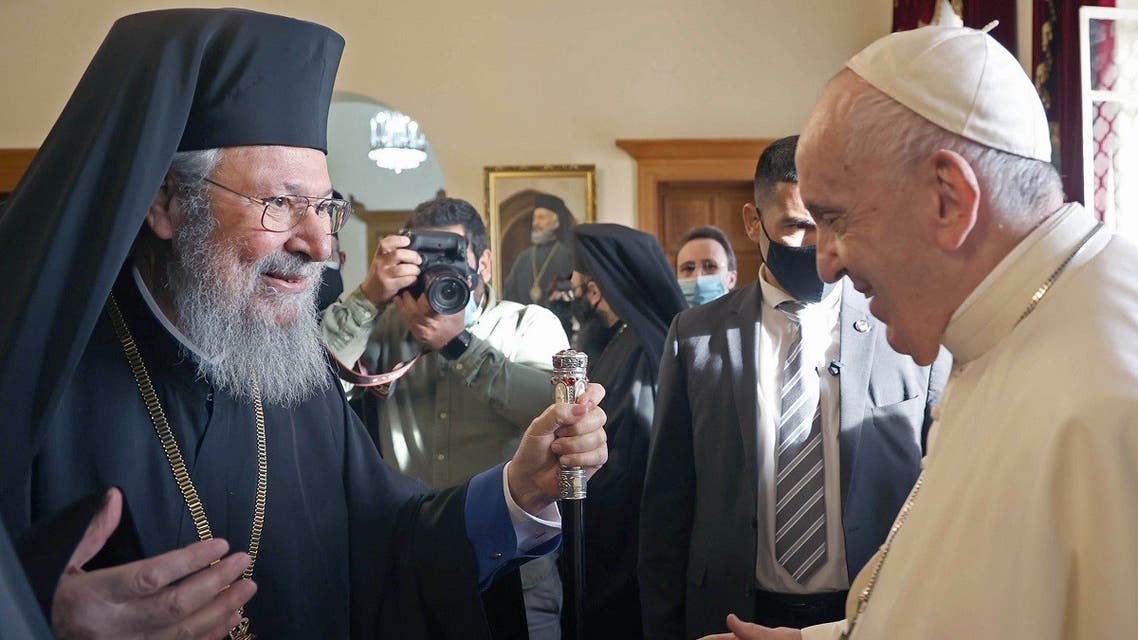 In this handout picture released by the Cypriot government’s press office (PIO), Archbishop Chrysostomos II (L) of Cyprus welcomes Pope Francis (R) at the Archbishopric of the Greek Orthodox Church in Nicosia, Europe’s last divided capital, on December 3, 2021. (Andreas Loucaides/PIO/AFP)