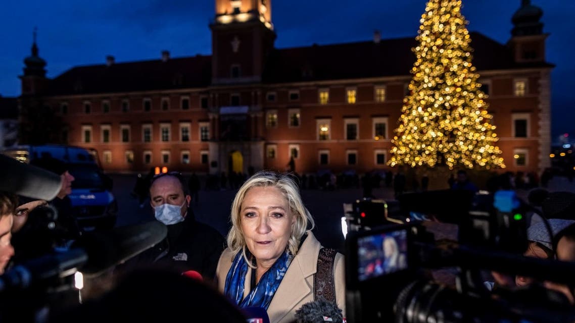 Leader of French far-right party Rassemblement National (RN) and candidate for the French presidential elections Marine Le Pen speaks with journlists at the Royal Castle Square in Warsaw, Poland on December 3, 2021. (AFP)