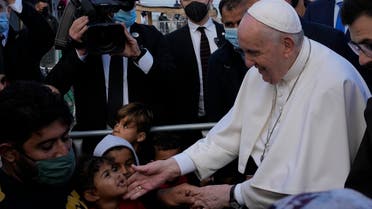 Pope Francis meets migrants during his visit at the Karatepe refugee camp, on the northeastern Aegean island of Lesbos, Greece, Sunday, Dec. 5, 2021. (AP)