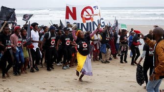 Protesters hit S. Africa beaches to oppose oil exploration by Shell  