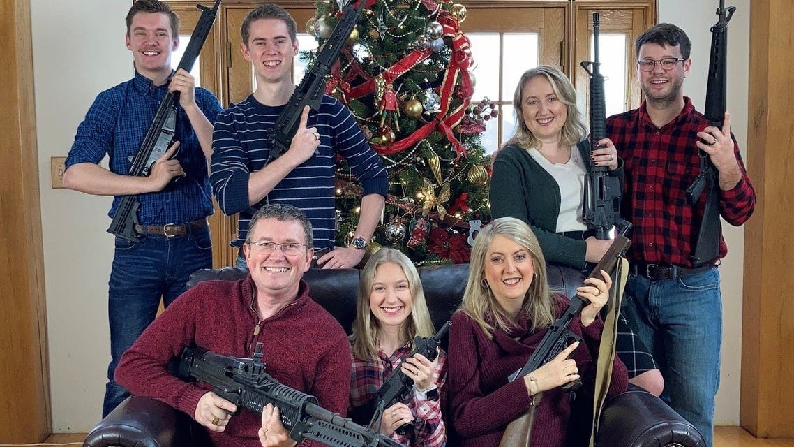 US Rep. Thomas Massie (R-KY) in a Christmas photo of his family holding guns, in this image obtained from Twitter, posted on December 4, 2021. (Reuters)