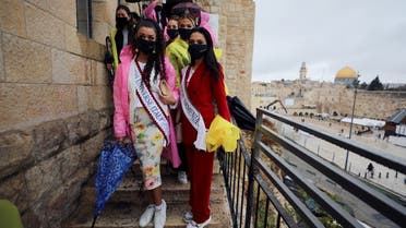 Miss Universe Armenia and Italy among other contestants gather near the Western Wall, Judaism's holiest prayer site, during a tour in Jerusalem's Old City ahead of the annual beauty pageant which will take place in the Red Sea resort of Eilat (File photo: Reuters), December 1, 2021.