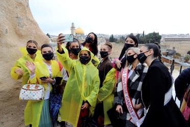 Miss Universe contestants take a selfie near the Western Wall, Judaism's holiest prayer site, during a tour in Jerusalem's Old City ahead of the annual beauty pageant which will take place in the Red Sea resort of Eilat, December 1, 2021. (File photo: Reuters)
