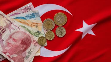 Close-up of Turkish Lira on Turkish Flag. stock photo