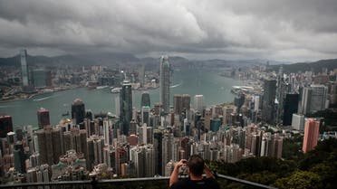 A visitor sets up his camera in the Victoria Peak area to photograph Hong Kong’s skyline.  (AP)