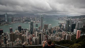 Hong Kong ramps up COVID-19 controls, bans flights from eight countries