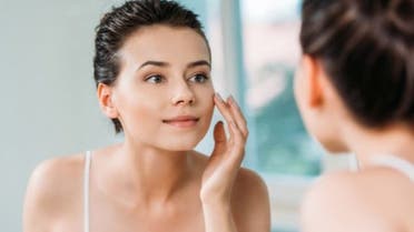 happy-woman-beauty-skin-face-mirror