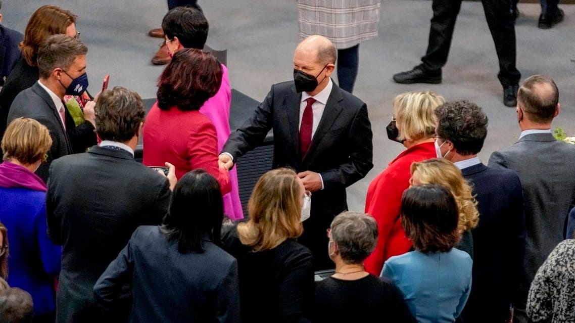 Olaf Scholz of the Social Democrats (center), is congratulated after he was elected new German Chancellor in the German Parliament Bundestag in Berlin, on Dec. 8, 2021. (AP)