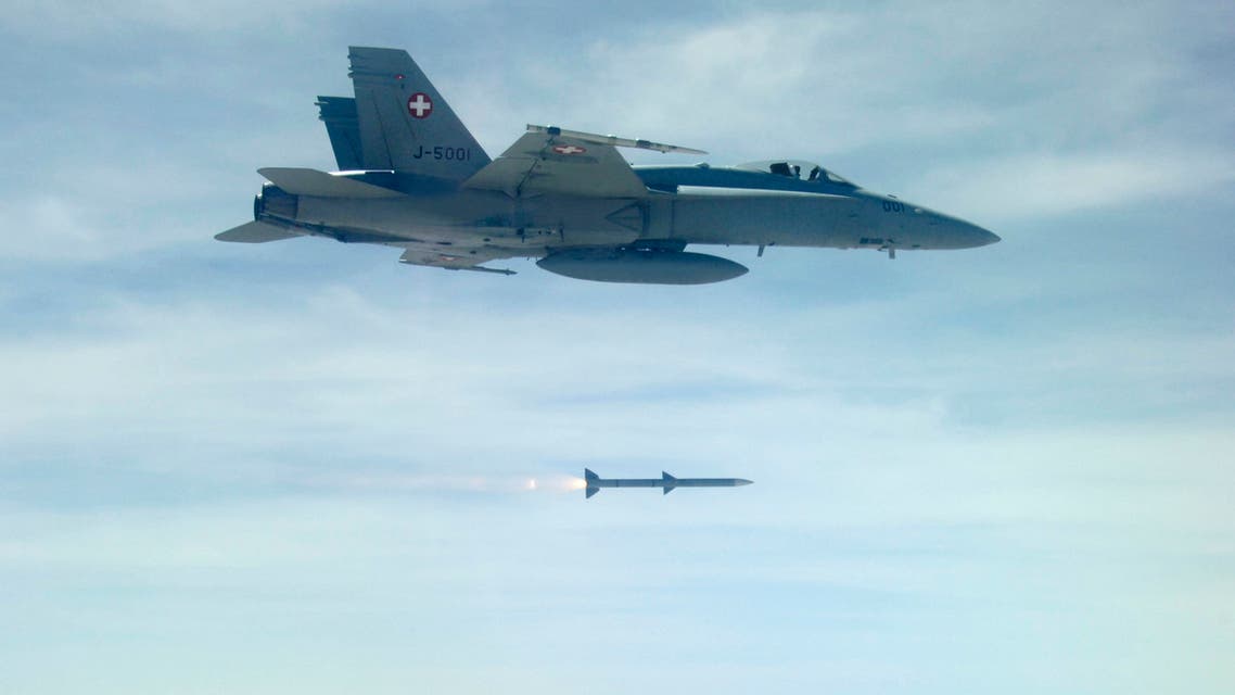 An undated handout picture shows a Swiss Air force F/A 18 fighter jet firing an AMRAAM AIM-120C-7 Air-to-Air Missile of the Swiss Army armament program for 2011. (Reuters)