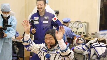 Spaceflight participant Yusaku Maezawa of Japan, member of the main crew of the new Soyuz mission to the International Space Station (ISS) gestures prior the launch at the Russian leased Baikonur cosmodrome, Kazakhstan, on Dec. 8, 2021. (AP)