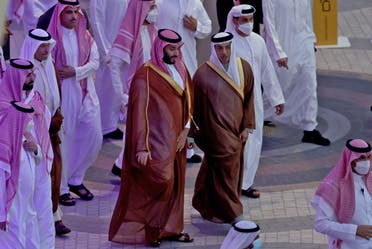 Saudi Arabia’s Crown Prince Mohammed bin Salman (C-L) is toured around Expo 2020 Dubai by the UAE’s deputy prime minister Sheikh Mansour bin Zayed Al-Nahyan (C-R), in the gulf emirate of Dubai on December 8, 2021. (AFP)