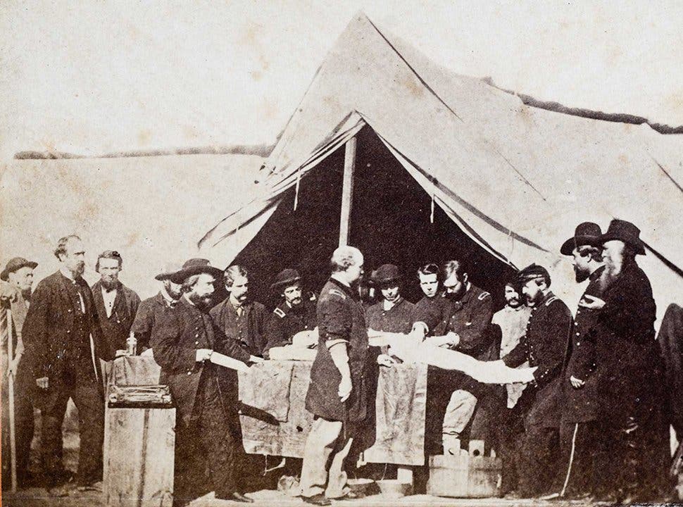 A picture of the process of treating a wounded person in the Civil War