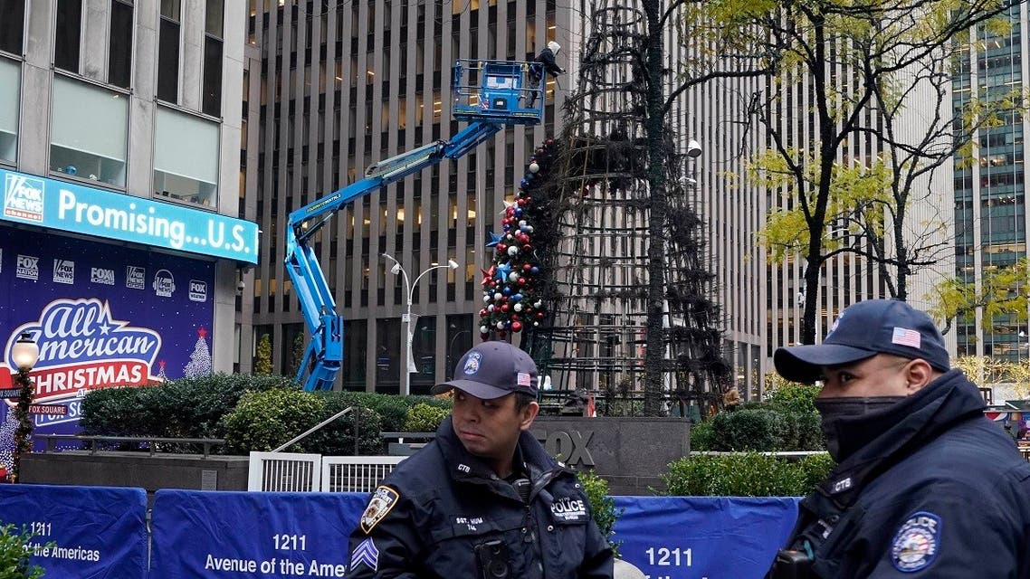 New York City Police stand outside Fox News headquarters as a Christmas tree is disassembled, in New York, Dec. 8, 2021. (AP/Richard Drew)