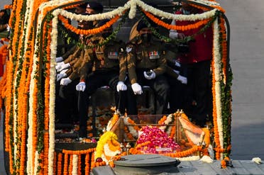 A gun carriage procession takes the coffin containing the mortal remains of Indian defense chief General Bipin Rawat to a funeral site in New Delhi on December 10, 2021. (AFP/Prakash Singh)