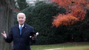 US President Joe Biden reacts to the sight of snow falling, while walking to Marine One at the South Lawn of the White House in Washington, US, on December 8, 2021. (Reuters)
