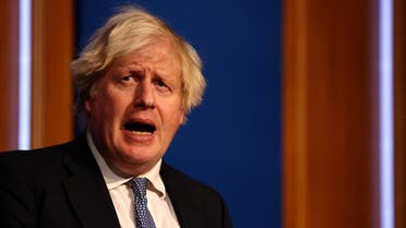 British Prime Minister Boris Johnson holds a news conference for the latest coronavirus disease update in the Downing Street briefing room, in London, Britain, on December 8, 2021. (Reuters)