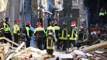 Members of a rescue team search for victims in the aftermath of a gas explosion in a residential building, in Ravanusa, Italy, on December 12, 2021. (Reuters)