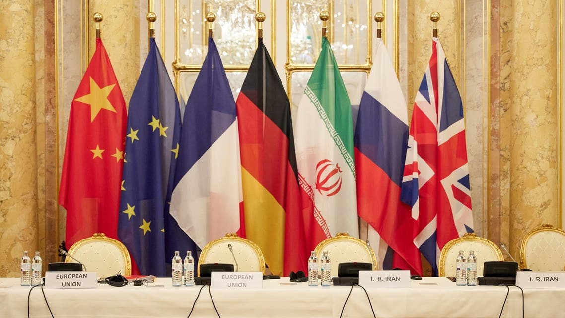 Flags of participating states during a meeting aimed at reviving the Iran nuclear deal in Vienna, Dec. 9, 2021. (AFP)