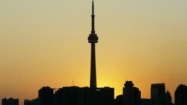 File photo of the CN Tower silhouetted against the setting sun as a blackout grips Toronto, Canada. (Reuters)