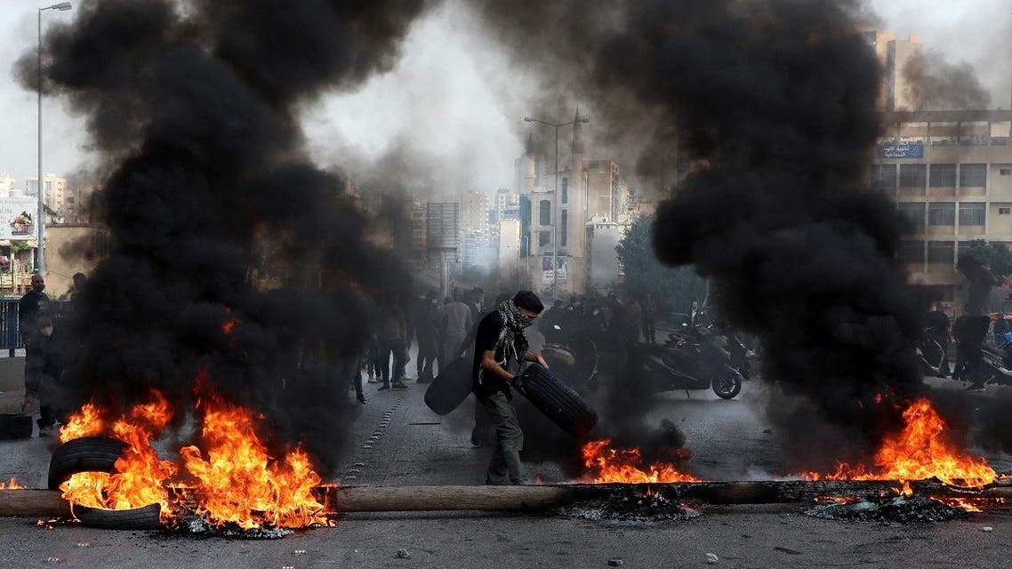Demonstrators burn tires during a protest on the back of the continuing deterioration of living conditions, in Beirut, Nov. 29, 2021. (Reuters)