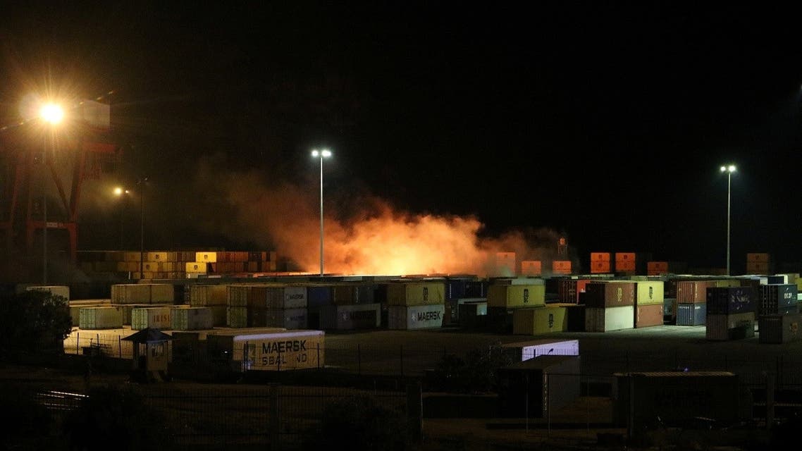 Smoke rises from a fire in a container storage area, after Syrian state media reported an Israeli air strike on the port of Latakia, Dec. 7, 2021. (Reuters)